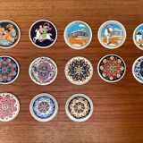 Set of 13 vintage ceramic coasters handmade by Lito Niarchos.