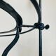 Foldable wrought iron support from the 19th century for a toilet set.