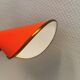 Danish red lacquered wall light with brass details. Estimated 1980s
