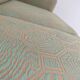 Pierre Frey modernist bench in green and gold patterned fabric