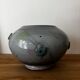 Magnificent pot or vase, handcrafted pottery with flowers, signed on the back.