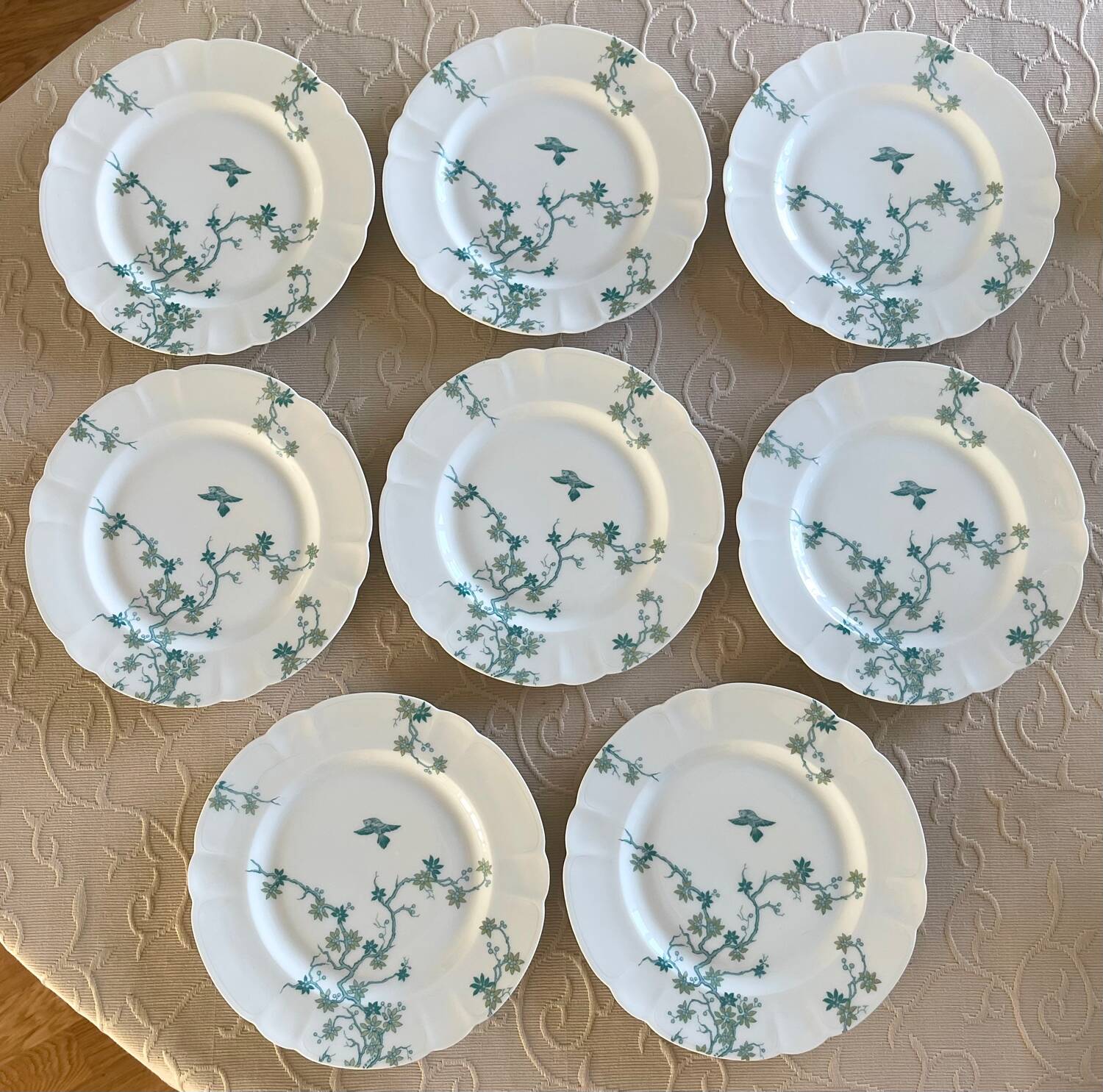 8 Haviland Limoges dinner plates.
