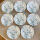 8 Haviland Limoges dinner plates.