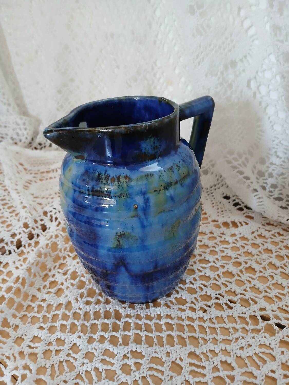 Antique pitcher in enamelled ceramic