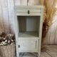 White patinated bedside table with a marble top