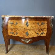 Louis XV style commode with floral marquetry decoration.