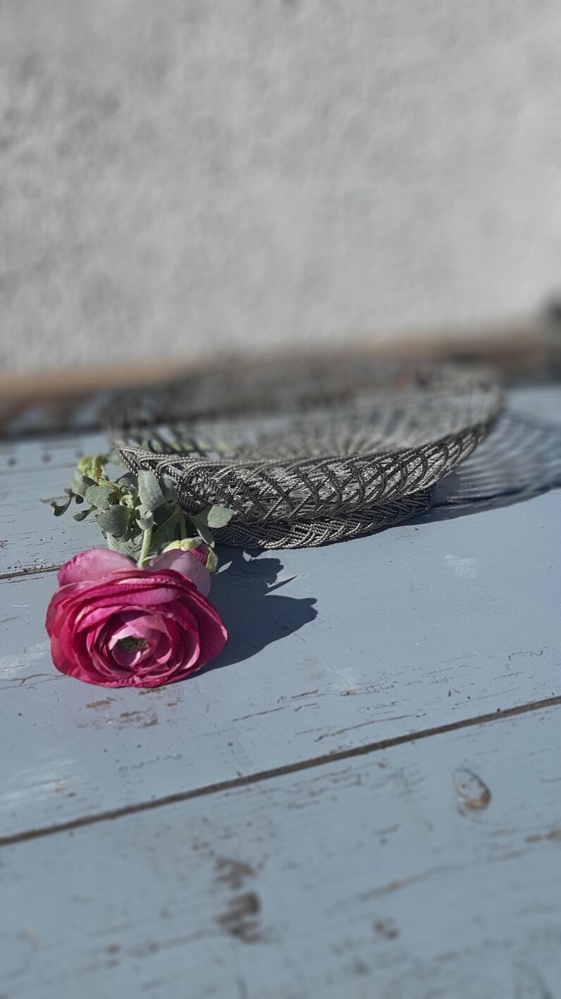 flat basket cut center table in woven metal