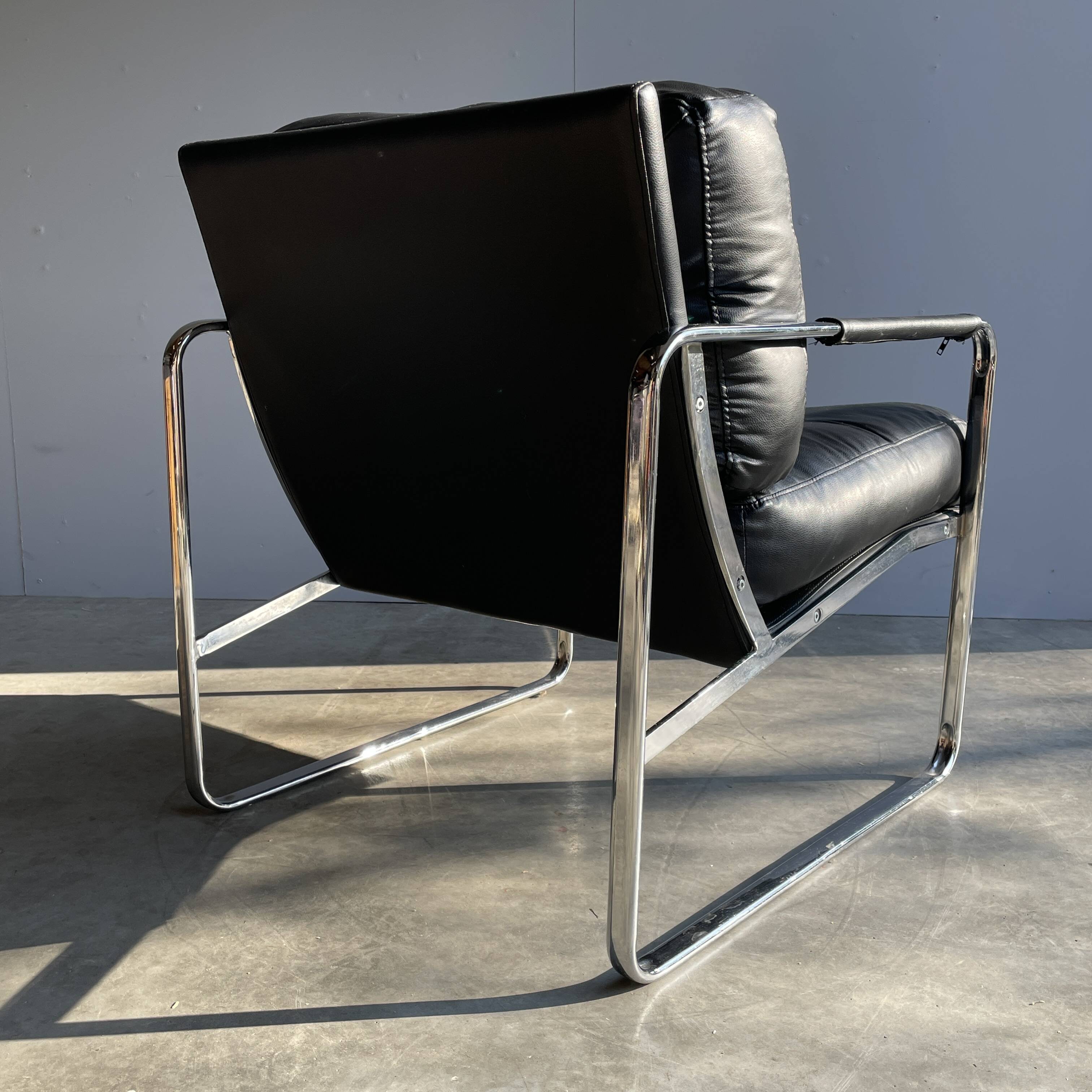 Vintage black leather armchair on metal base, 1980s