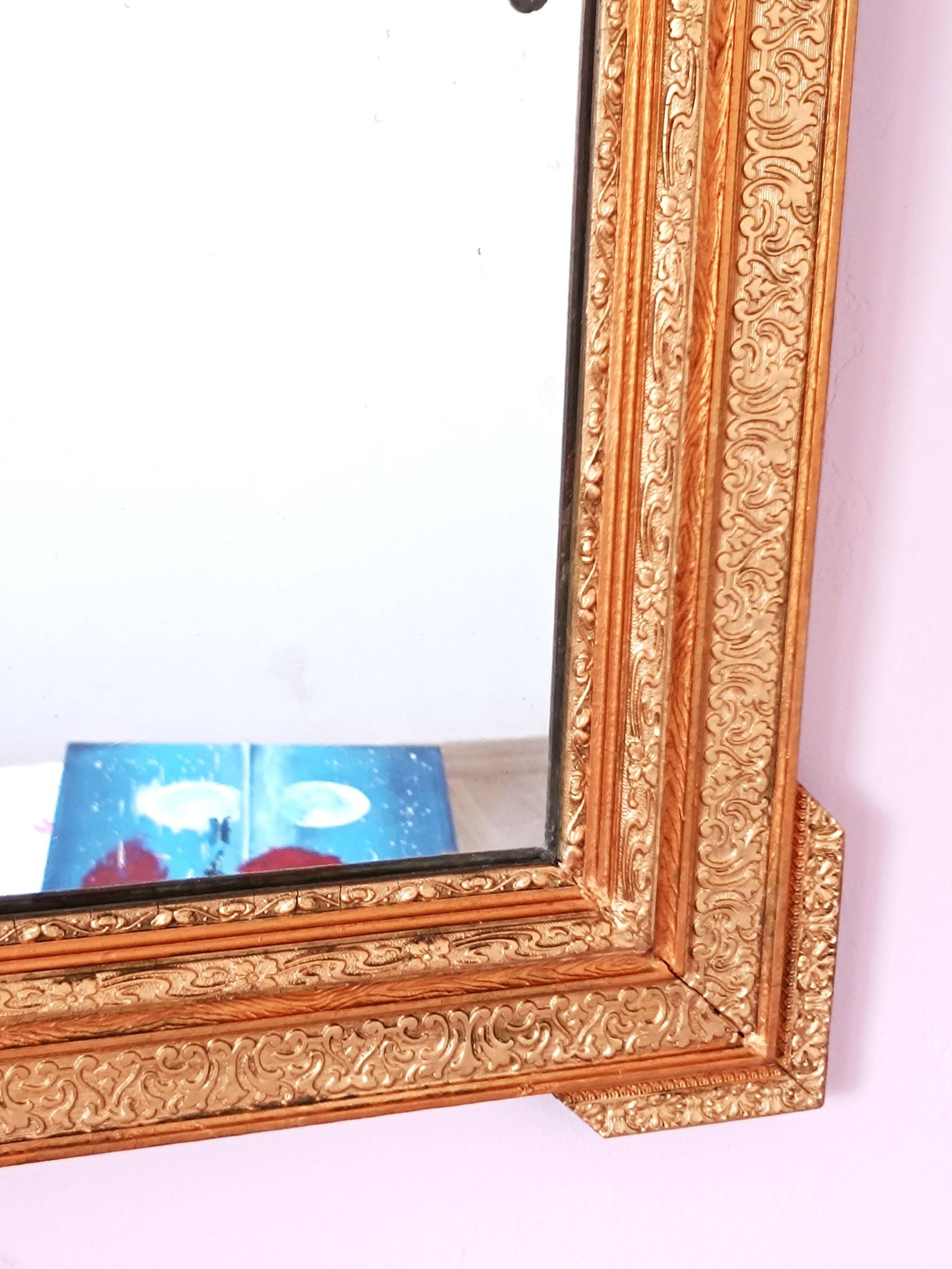 Napoleon III mirror with rich gilded ornamentation