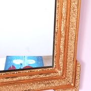 Napoleon III mirror with rich gilded ornamentation