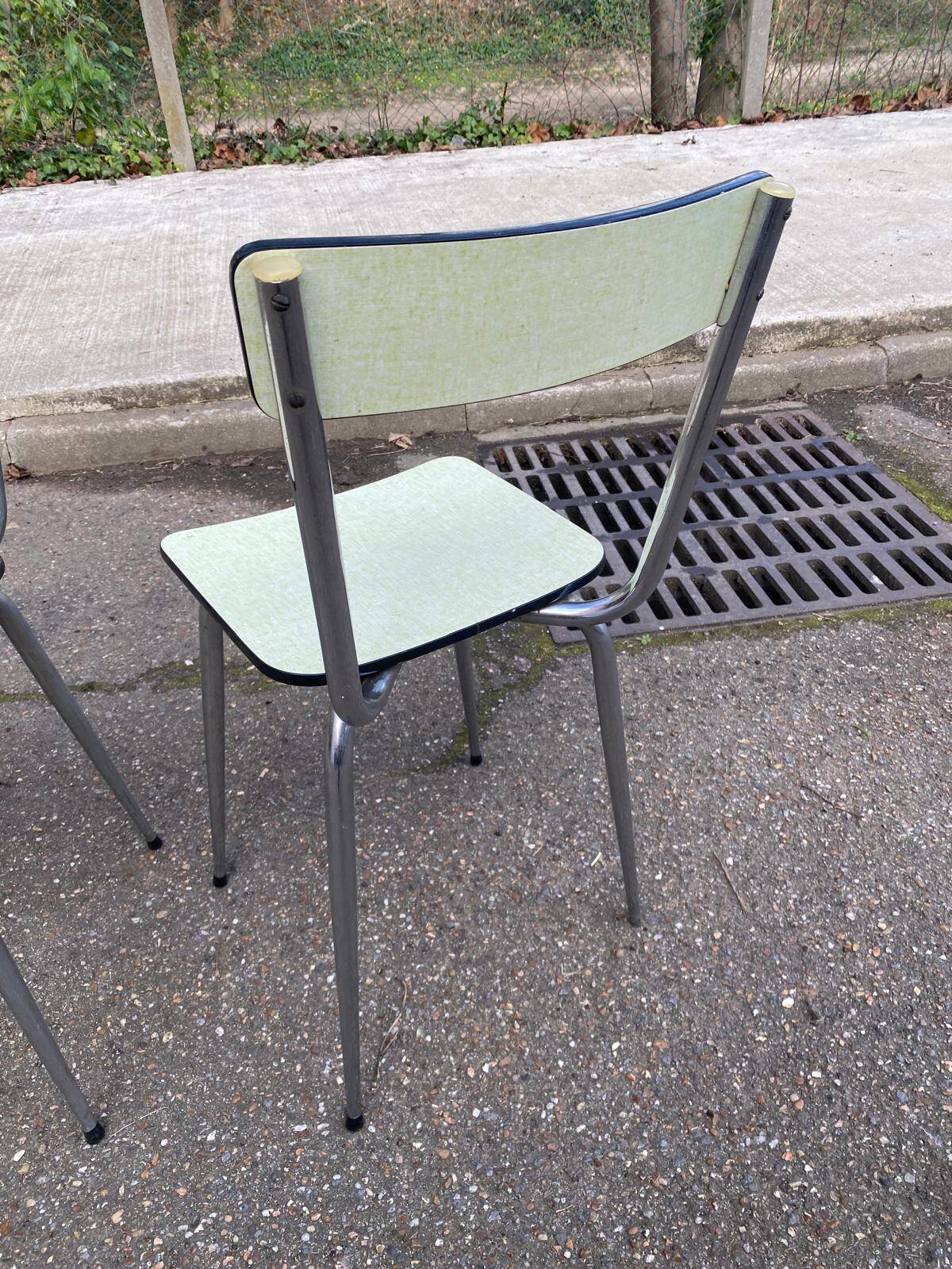 2 light green Formica and steel chairs from the 1980s.
