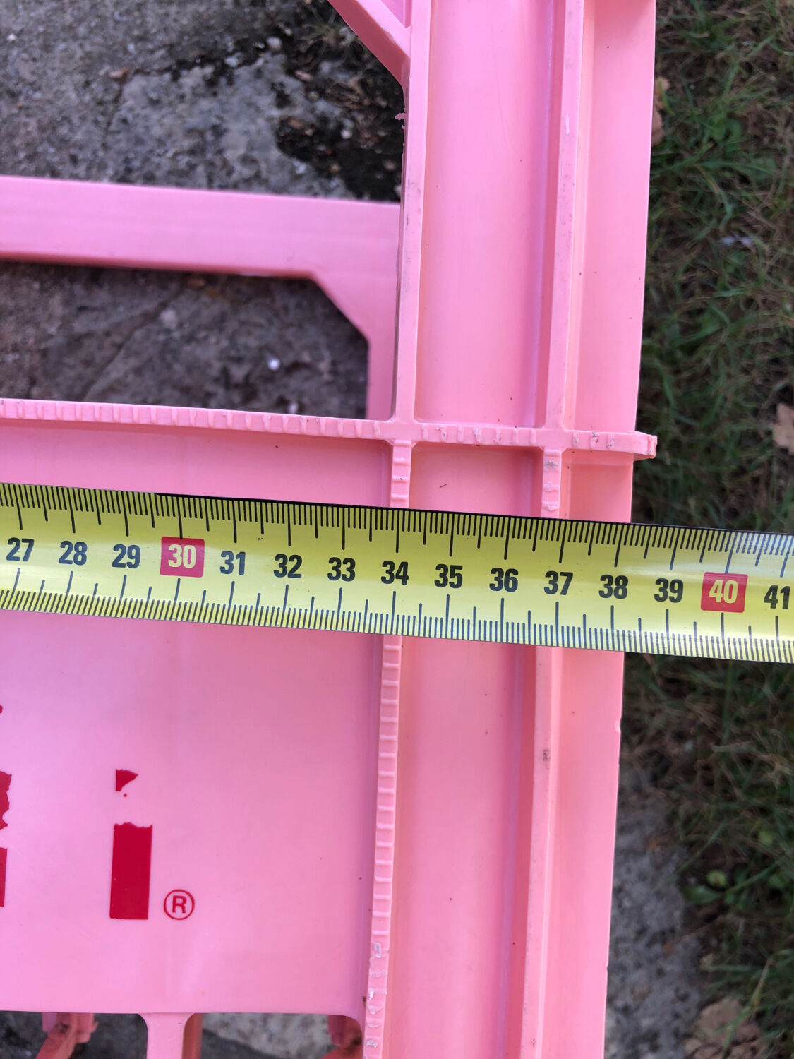 Evian bottle holder in pink plastic