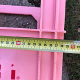 Evian bottle holder in pink plastic