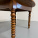Oval dining table in solid wood with turned legs from the 1950s.