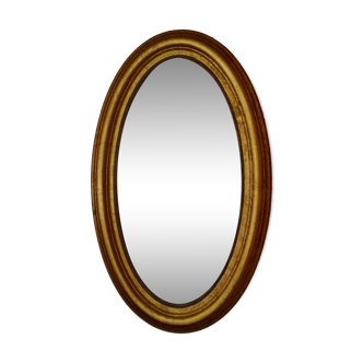 Golden oval mirror