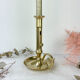 Brass candle holder with pusher late nineteenth century