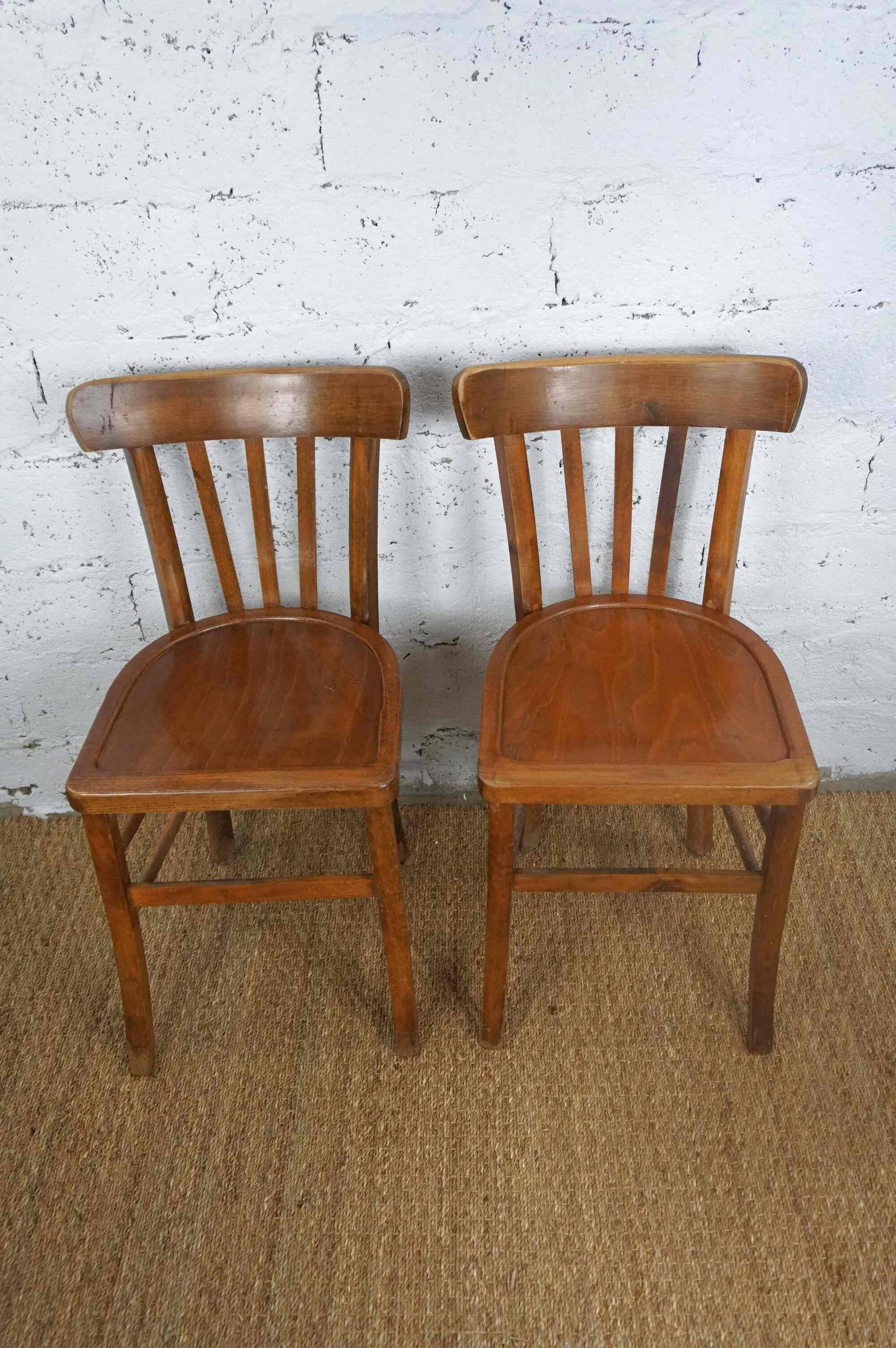 pair of vintage wooden bistro chairs