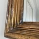 Antique giltwood wall mirror in gold