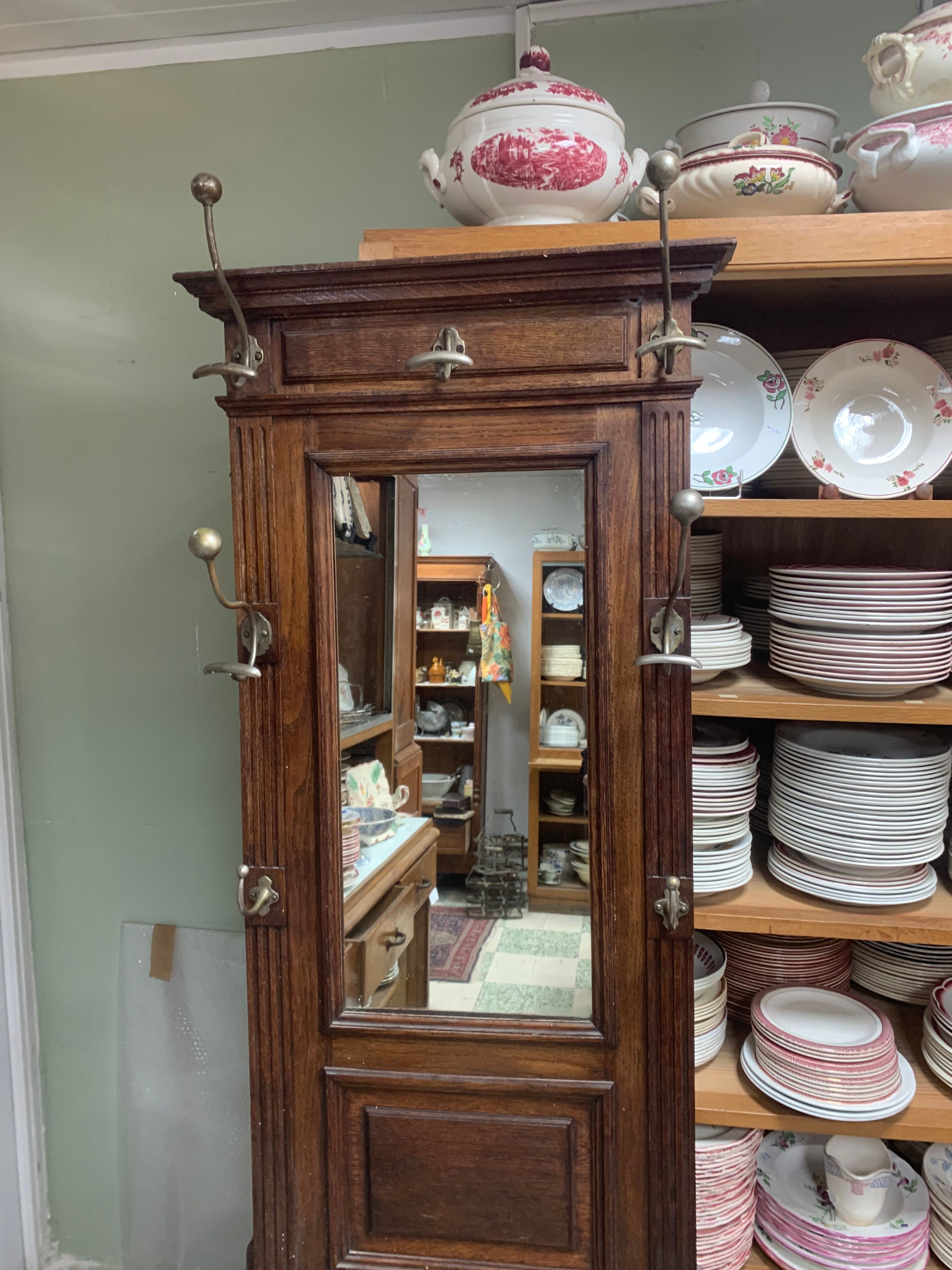 Old wall-mounted mantle-holder cloakroom in see
