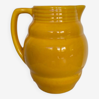 Old yellow ceramic pitcher