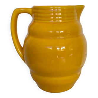 Old yellow ceramic pitcher