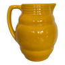 Old yellow ceramic pitcher