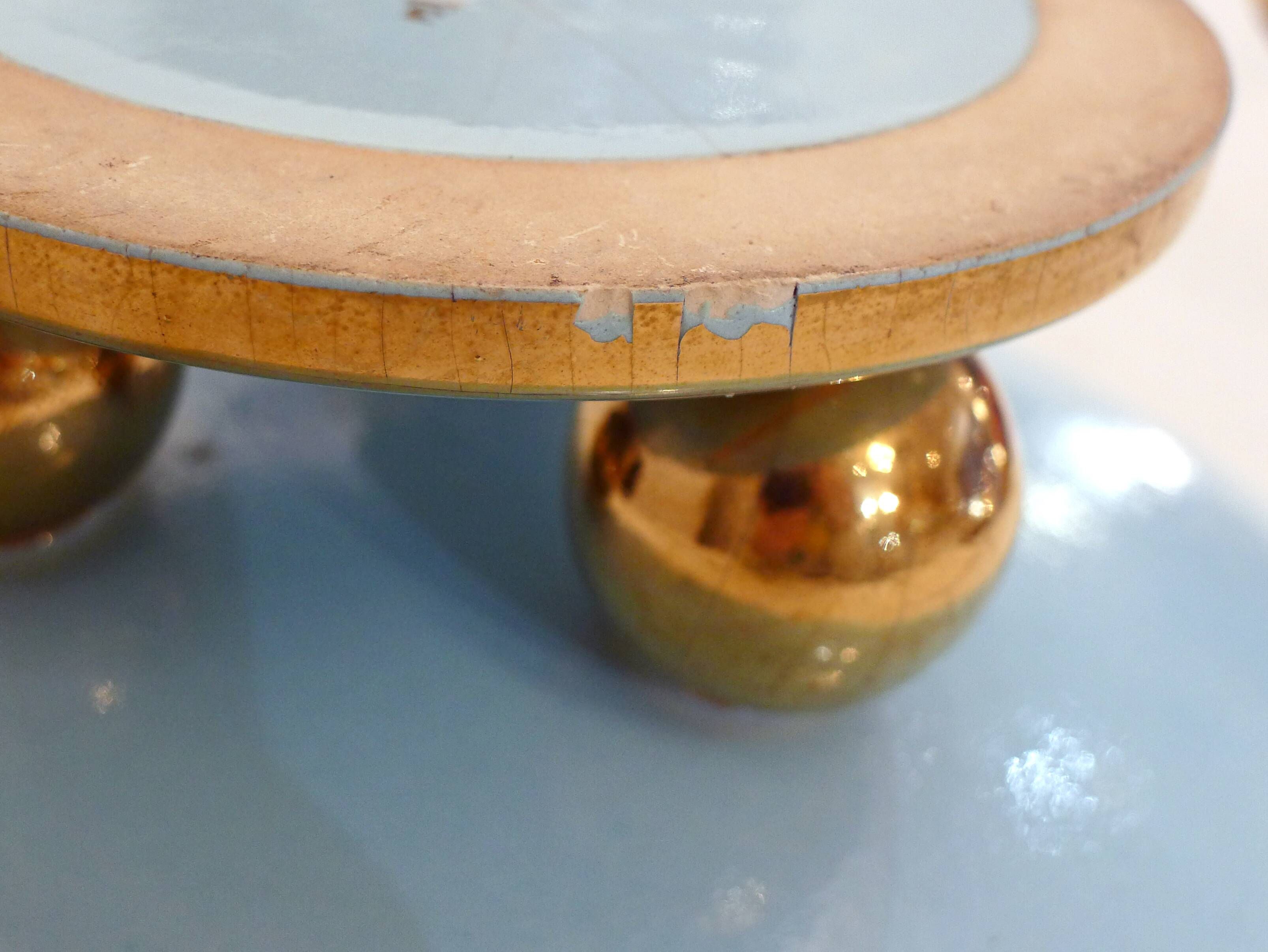 Art Deco modernist coupe, with a base of 3 spheres, in turquoise ceramic and gilding.