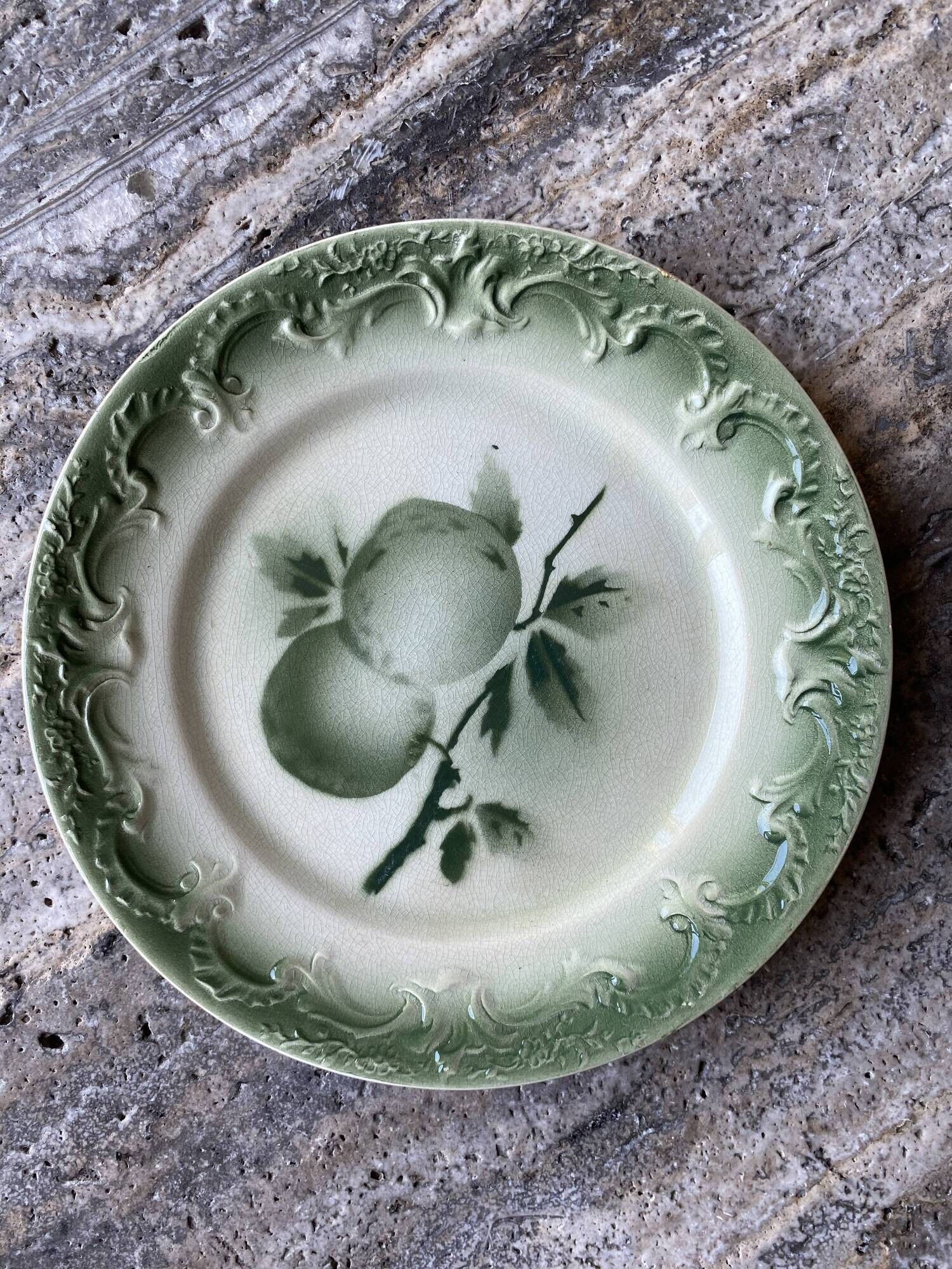11 old dessert plates from the Pexonne earthenware factory, green and cream fruit decoration