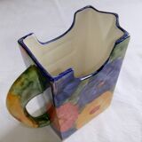 Ceramic vase pitcher decorated with flowers