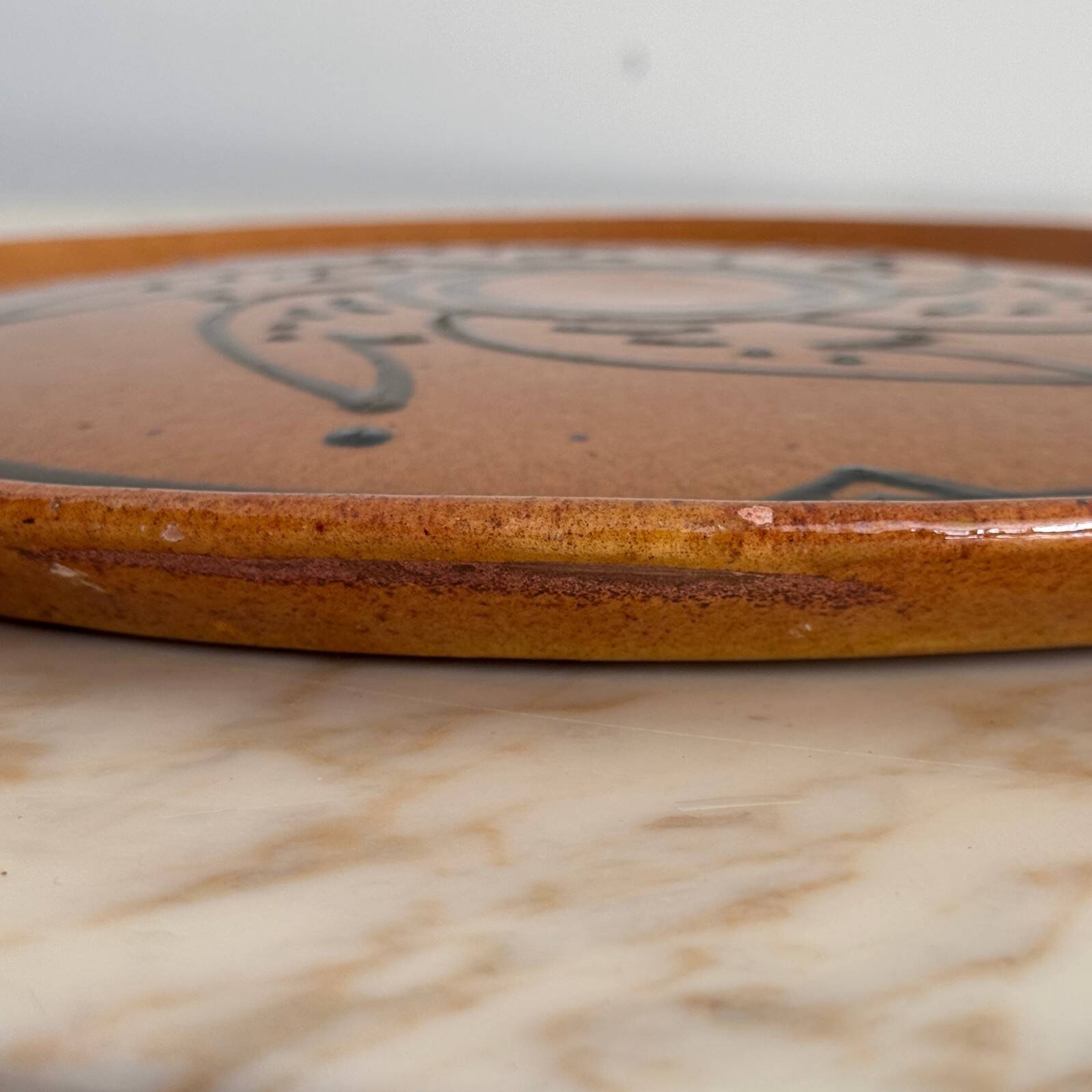 Round glazed earthenware dish by Biot, 20th century, stylized decoration