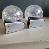 Pair of vintage wall lights in chrome metal with bubbled glass globes.