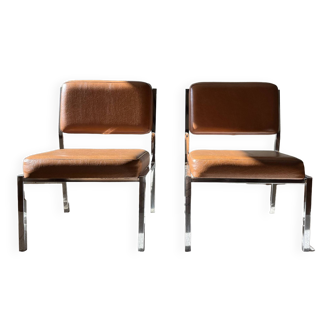 Pair of modernist chrome and brown skai low chairs