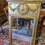 Golden patinated trumeau mirror