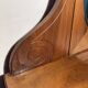 Antique carved wooden dressing table with marble and tilting oval mirror.