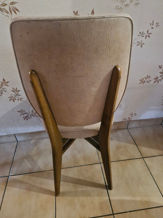 4 solid wood chairs with beige faux leather.