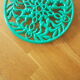 Green enamelled cast iron table mat