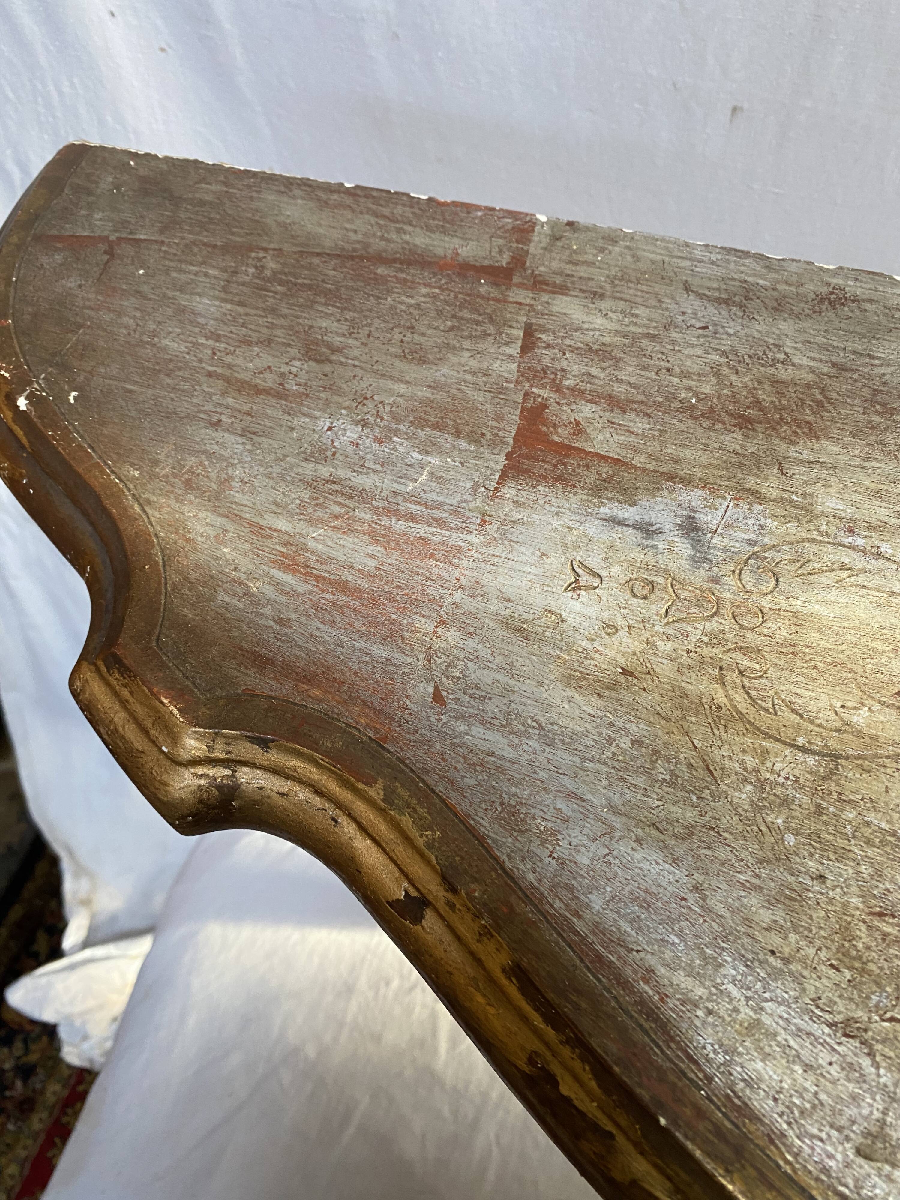 Wooden wall console and antique gilded stucco