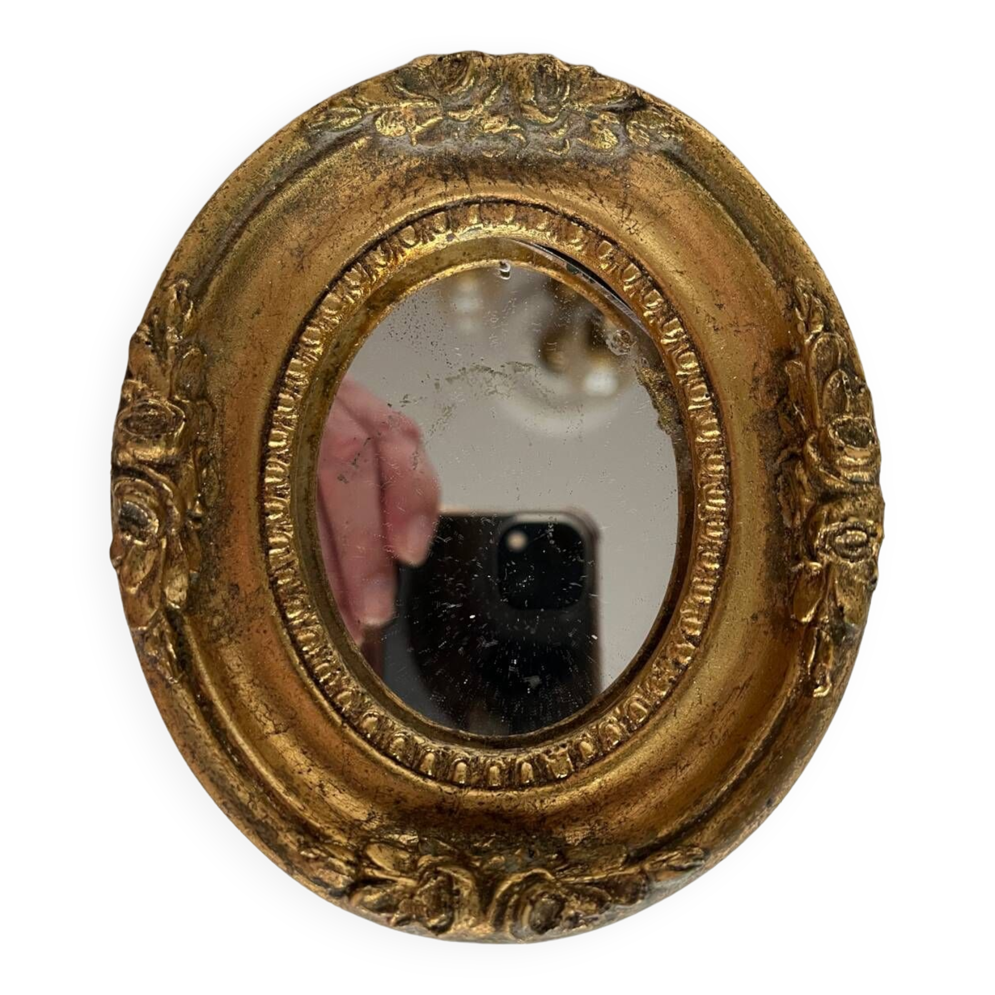 Small old mirror in gilded wood
