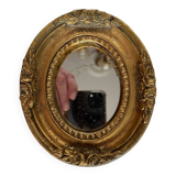 Small old mirror in gilded wood