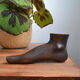 Carved wooden Buddha's foot