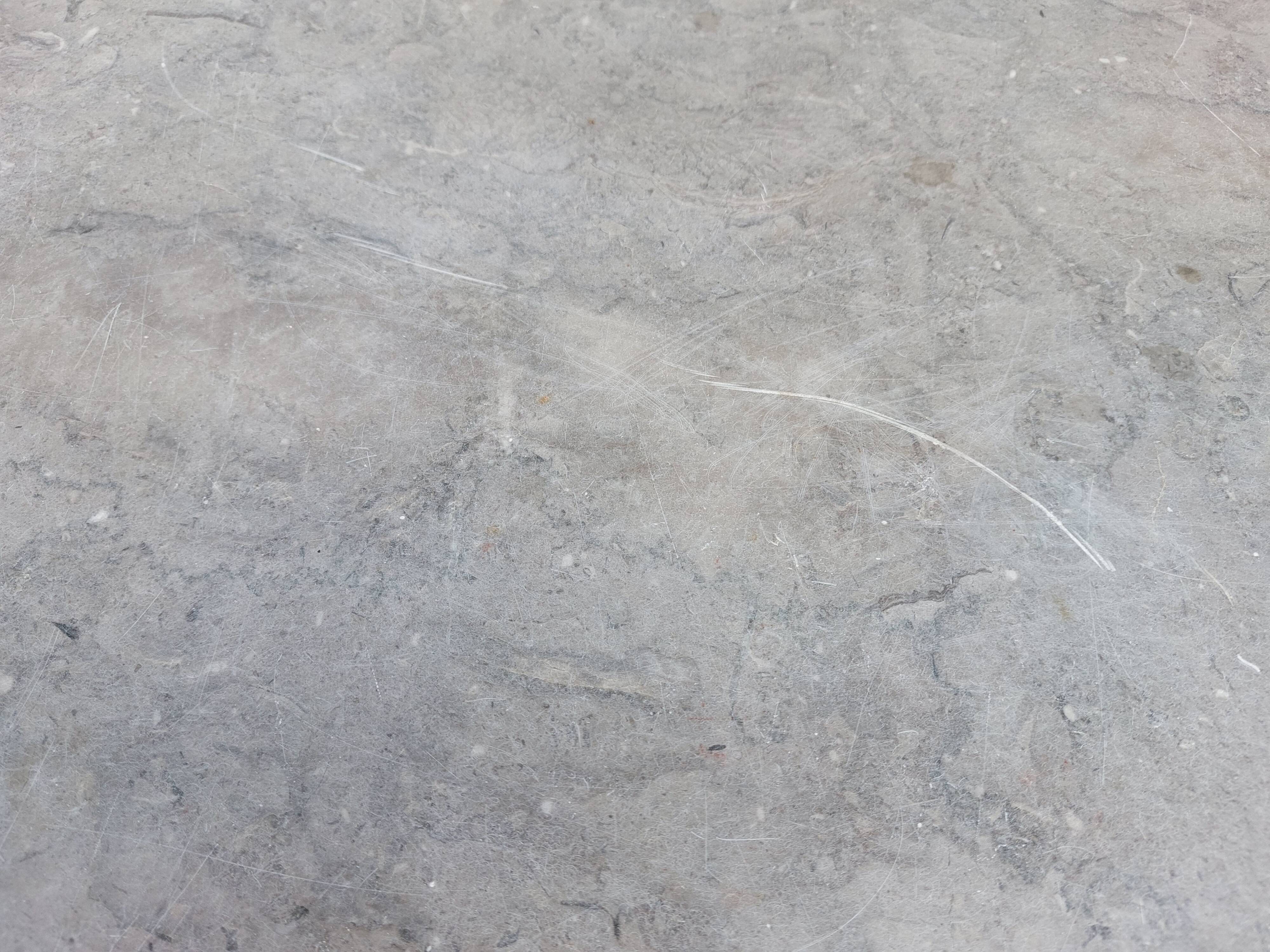 Vintage wooden buffet with a marble top.