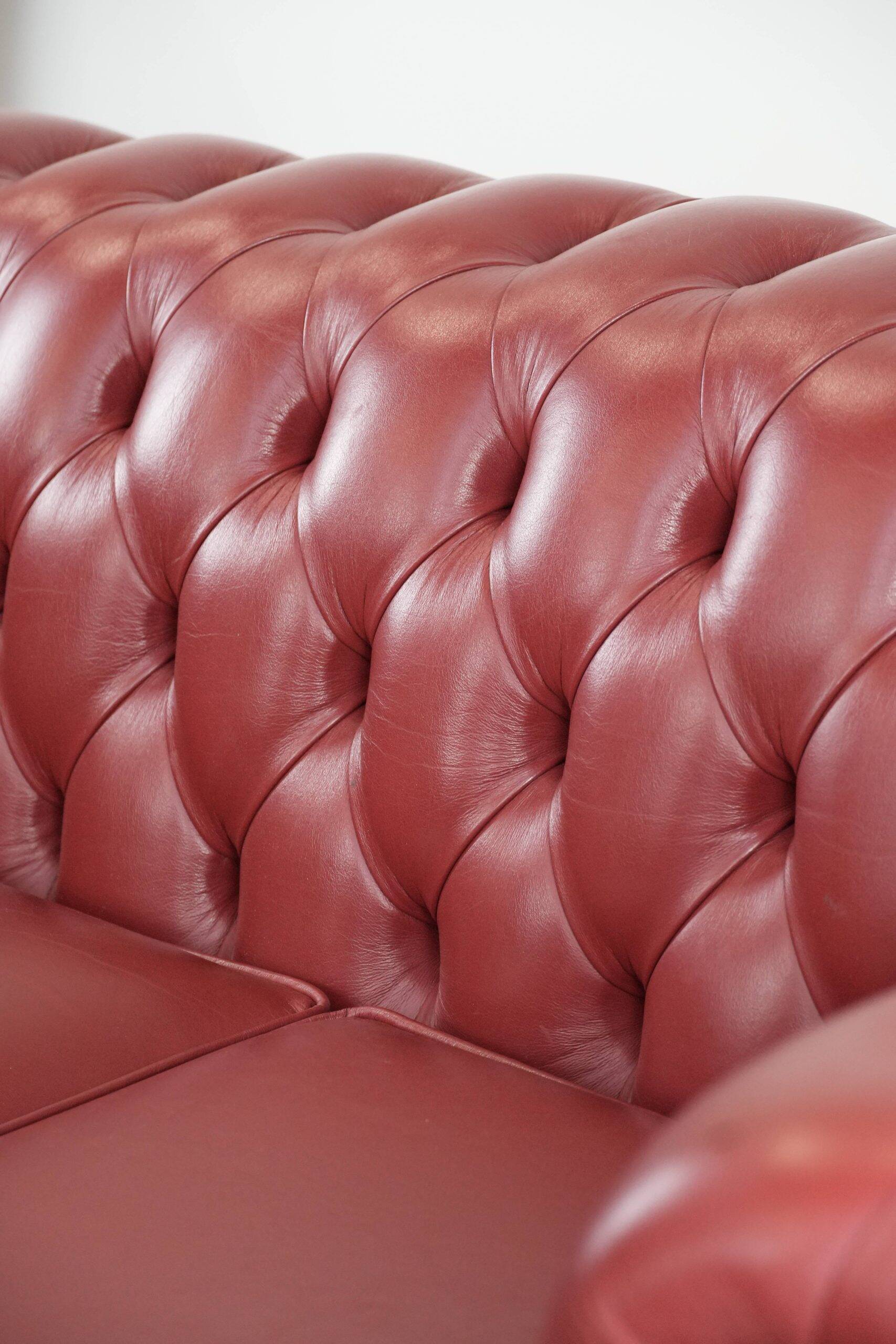 English cowhide Chesterfield 2.5-seater sofa in a stunning red colour