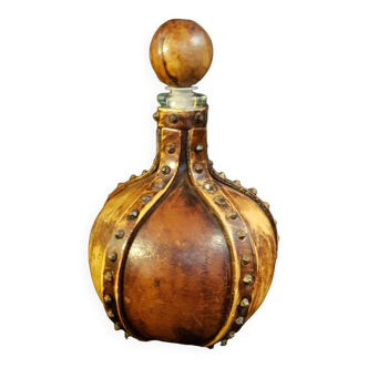 Old bottle covered with leather