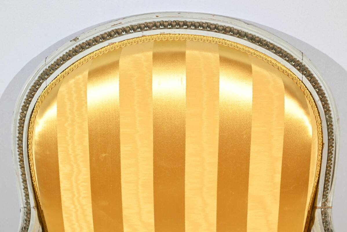 Pair of Cabriolet Armchairs, in rechampi wood, Louis XVI style – Late 19th century