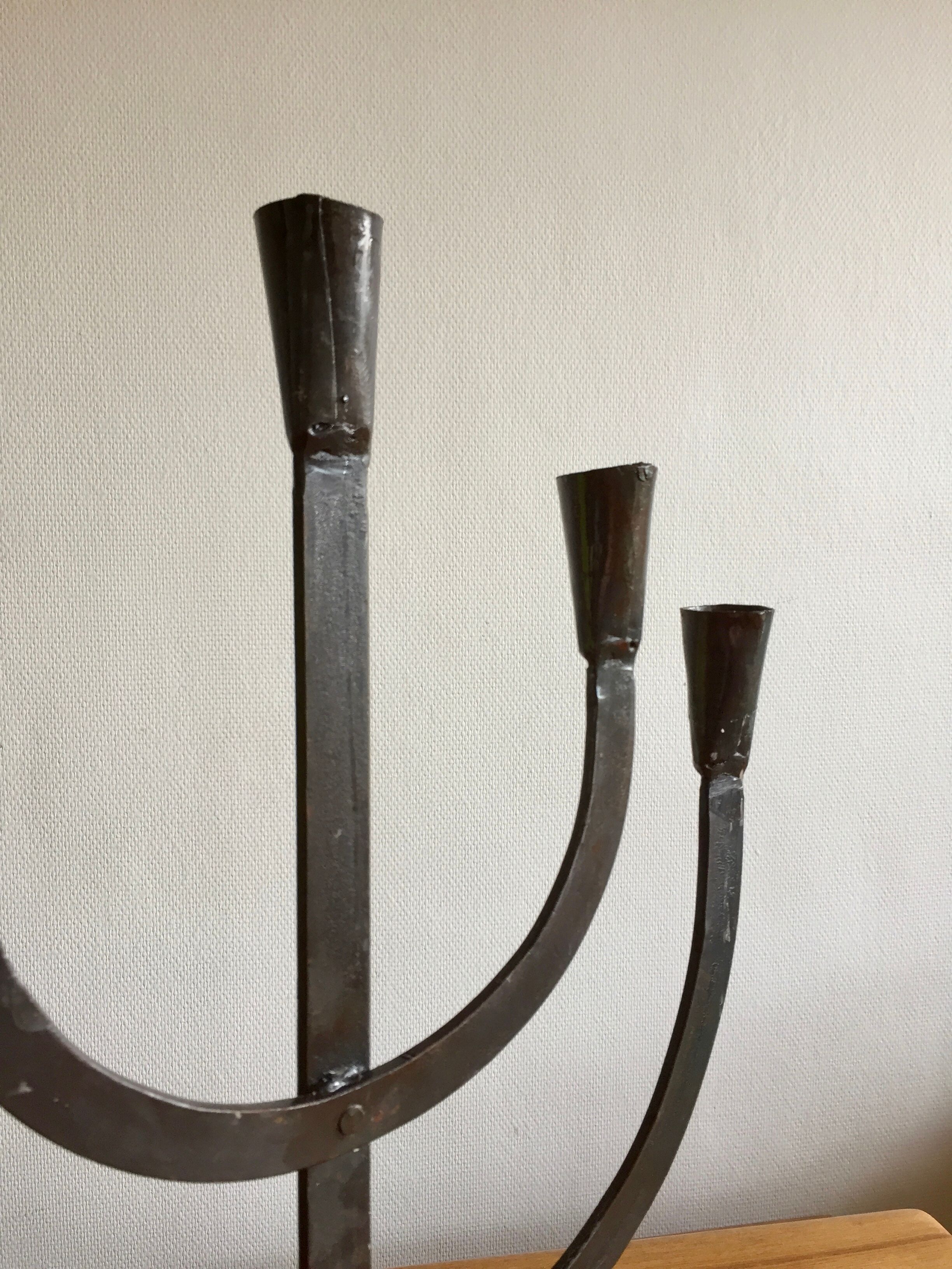 Old iron candelabra shaped high time