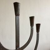 Old iron candelabra shaped high time