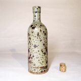 Bottle vase in speckled sandstone