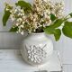 Small ceramic vase with floral relief