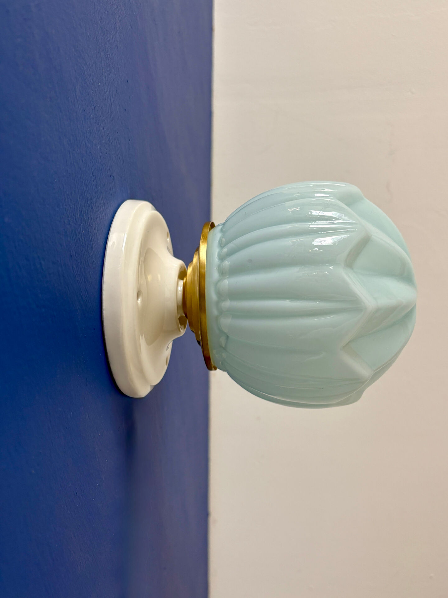 Vintage Art Deco globe wall light in blue opaline.