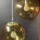 Pair of vintage smoked glass ball pendant lights from Biot glassworks